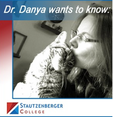 Dr. Danya kissing her cat