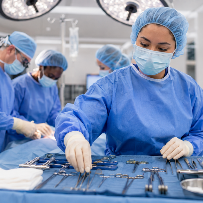 Stautzenberger surgical technology student learning instrument prep for surgical teams in an operating room lab